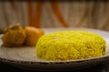 Pulav and potato curry served on a plate. Traditional Bengali basanti polao or sweet polao or fried rice served as offering to the