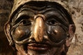 Pulcinella mask. Bronze sculpture of the typical mask of Campania and Naples