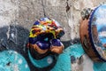 Pulcinella Neapolitan comedy mask hanging on the wall on the streets of Naples