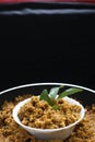 Puliyogare rice in the cooking pan with bowl, yellow color indian rice