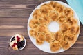 Pull apart monkey bread with black currant jam in a plate on a wooden plate Royalty Free Stock Photo