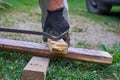 pull the nail out of the board,pulling rusty nails from a board Royalty Free Stock Photo