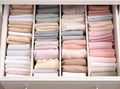 pull-out chest shelf,things in pastel colors are arranged in organized manner