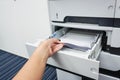 Pull paper from printer tray Royalty Free Stock Photo
