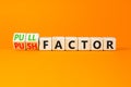 Pull or push factor symbol. Concept word Pull factor and Push factor on wooden cubes. Beautiful orange table orange background. Royalty Free Stock Photo