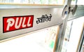 Pull sign with a Pull handle on glass door Royalty Free Stock Photo