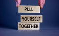 Pull yourself together symbol. Wooden blocks with words `Pull yourself together`. Beautiful grey background. Copy space. Busines