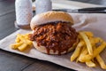 Pulled pork barbecue sandwich with french fries Royalty Free Stock Photo