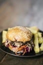 Pulled pork and coleslaw salad burger sandwich with fries meal