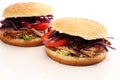 Pulled pork sandwiches with BBQ sauce, cabbage and tomato on tab Royalty Free Stock Photo