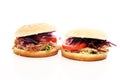 Pulled pork sandwiches with BBQ sauce, cabbage and tomato on tab Royalty Free Stock Photo