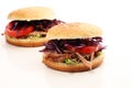 Pulled pork sandwiches with BBQ sauce, cabbage and tomato on tab Royalty Free Stock Photo