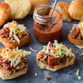 Pulled pork sliders with homemade tangy barbecue sauce. Square crop.