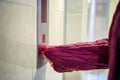 A woman panicked when she needed to press an elevator button. Royalty Free Stock Photo