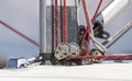 Pulley and rope system at the base of the mast for sail installing on board the yacht