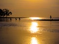 Pulling in the days catch, family of fishermen working together at sunset