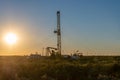 Pulling equipment in oil field at sunset Royalty Free Stock Photo