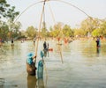 Pulling fish net in thailand. Royalty Free Stock Photo