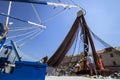 Fishermen arrange net on ship deck Royalty Free Stock Photo