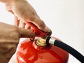 Male hands presses the trigger fire extinguisher,Closeup Royalty Free Stock Photo