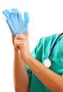 Pulling on surgical glove Royalty Free Stock Photo