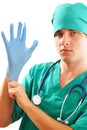 Pulling on surgical glove Royalty Free Stock Photo