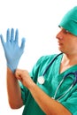 Pulling on surgical glove Royalty Free Stock Photo