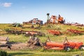 A battered old truck and farm equipment in the Palouse hills