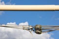 Pully with ropework against a blue summer sky