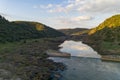 Pulo do Lobo waterfall drone aerial view with river guadiana and beautiful green valley landscape at sunset in Mertola Alentejo,