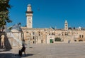 The Pulpit minbar, located to the south side of the Golden Dome of the Rock, a woman sitting at the square of the Islamic shrine,