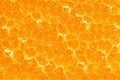 Pulpy texture of an orange juicy fruit flesh for a background