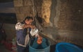 Pulquero master serving pulque in clay jars, a traditional Mexican natural alcoholic drink