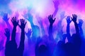 Pulsating nightclub, where hands are raised high, colorful lights create a mesmerizing spectacle. Ai generated