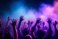 Pulsating nightclub, where hands are raised high, colorful lights create a mesmerizing spectacle. Ai generated