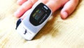 PULSE OXIMETER .Children measure their own oxygen and heart rate. Close-up of digital pulse oximeter.