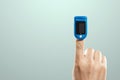 Pulse oximeter, digital device for measuring blood oxygen saturation and pulse rate on the finger. Medical research, close-up