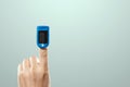 Pulse oximeter, digital device for measuring blood oxygen saturation and pulse rate on the finger. Medical research, close-up