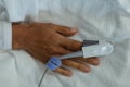 Pulse oximetry on patient hand in the ward at hospital