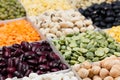 Pulses food background, assortment - legume, kidney beans, peas, lentils in square cells macro.