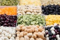 Pulses food background, assortment - legume, kidney beans, peas, lentils in square cells macro.