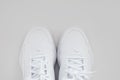 puma. white sneakers with laces on a white background. isolate. top view.