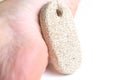 Pumice stone for cleaning feet and heels, on white background. Royalty Free Stock Photo