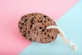 Pumice stone close up and copy space. Pumice stone 3d on a pink background. Beauty concept. Background for cosmetic product brandi