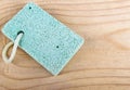 Pumice stone scrub tool on wooden board Spa concept