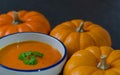 Pumpkin soup and row of pumkins