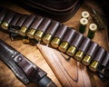 Pump action shotgun, 12 guage cartridge and hunting knife Royalty Free Stock Photo