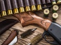 Pump action shotgun, 12 guage cartridge and hunting knife Royalty Free Stock Photo