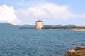 A pump house in the middle of the maithon lake with beautiful clouds Royalty Free Stock Photo