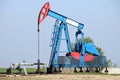 Pump jack on field oil and gas Royalty Free Stock Photo